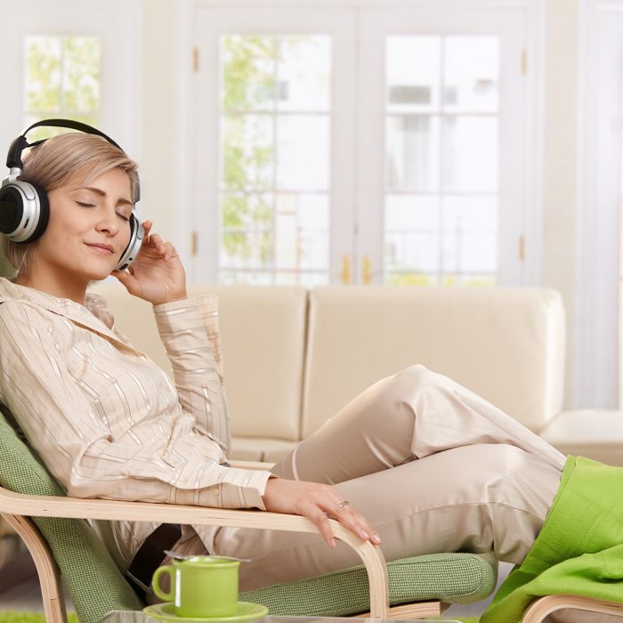 woman listening to her Relaxation Therapy